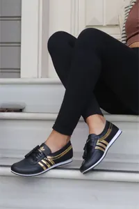 Baskets tendance noir et doré – Style sportif élégant